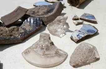 Shards of leaded glass and pottery have been discovered at an Archaeological dig at the site of the new Old Point Bank building in downtown Hampton. 