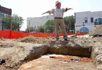 In downtown Hampton, Hank D. Lutton, project archaeologist shows off one of the corners with uncovered bricks of the dig. Archaeologists exploring the future site of the Old Point Bank building on Queen Street in downtown Hampton have uncovered the remains of an 18th-century foundation that could be linked to the famous seafaring Barron family of Hampton and Norfolk.