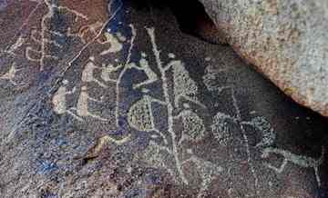 The ancient Aboriginal rock carving known as 'Climbing Man'.
