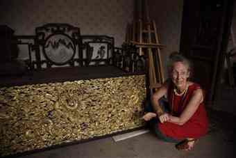 Nancy Berliner, curator of Chinese art and culture at the Peabody, reacts near a restored panel at the Forbidden City in Beijing, China. A collection of thrones, large-scale paintings and decor of one of China's most powerful leaders is leaving the country for the first time. In September, the $1.5 million exhibition of items from Chinese emperor Qianlong's period, arrives in Massachusetts for a tour that will show a more intimate side of a country often defined by vastness and control.
