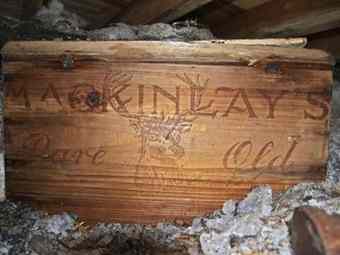 one of crates of Scotch whisky and brandy is pictured after they have been recovered by a team restoring an Antarctic hut used more than 100 years ago by famed polar explorer Ernest Shackleton.