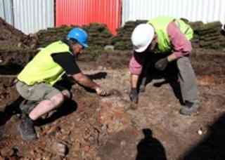 Senior Archaeologist Dave Sankey and Laurie Elrin work at the excavation site in Altab Ali Park, Whitechapel.