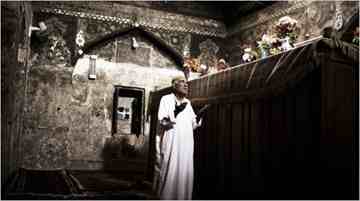 A Muslim prays at the tomb of the Prophet Ezekiel in Kifl, south of Baghdad. Ezekiel, a Jewish prophet, is also revered by Muslim pilgrims.
