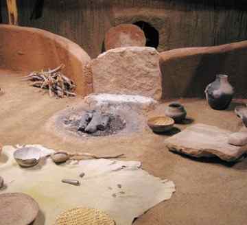 This reconstruction shows what the interior of a pit house at Sacred Ridge might have looked like before the attack.