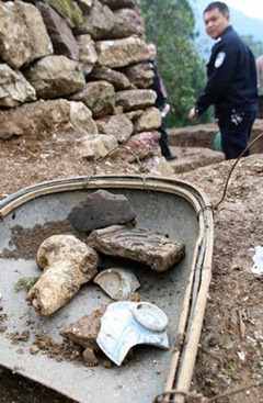Porcelain fragments and other finds unearthed from the old Tusi city's ruins site. 