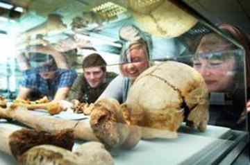 College students view the bones found under a quad at St John’s College 