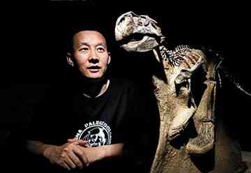 Discoverer of more dinosaur species than any other living scientist, Xu Xing, with a cast of parrot-faced Psittacosaurus, says some dinosaurs have birdlike traits, including feathers.