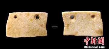 20,000 year-old drilled Ostrich shells found in Henan (Photo by Yufen/Chinanews.com).