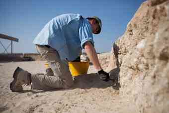 Dr Joseph Elders chips away at the dig site.