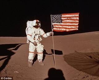 For all mankind: Apollo 14 astronaut Alan B Shepard plants the U.S. flag on the Moon in February 1971. It was on this mission that Nasa planted seismic sensors.