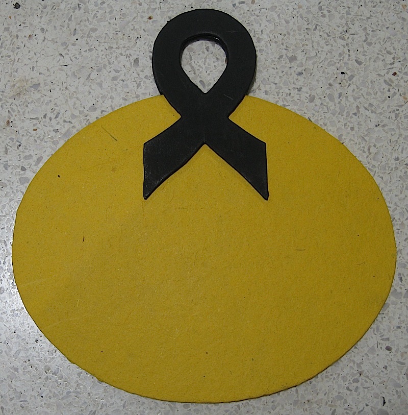 yellow fan with ribbon