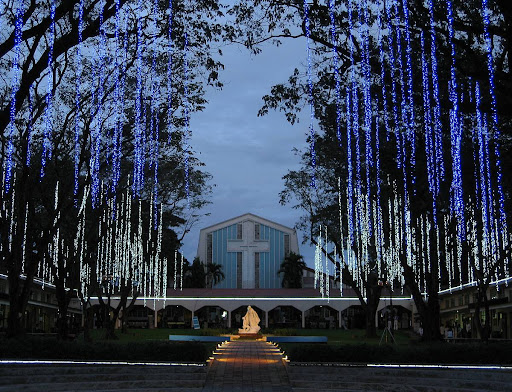 The Promenade of Our Lady and St. Stanislaus Kostka Chapel at the Ateneo de Manila High School at dusk