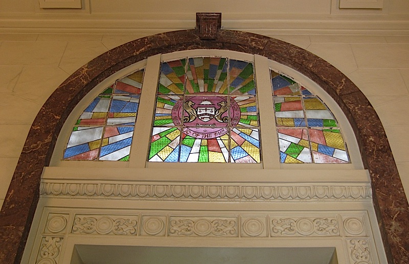 arched stained glass window over a door at the Museum of the Filipino People
