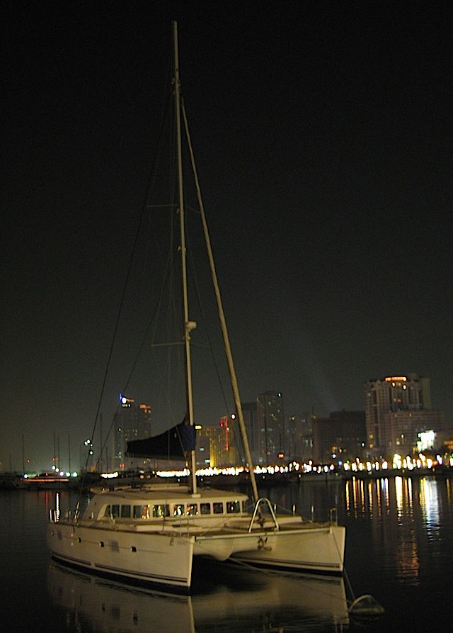 a catamaran docked in Manila Bay