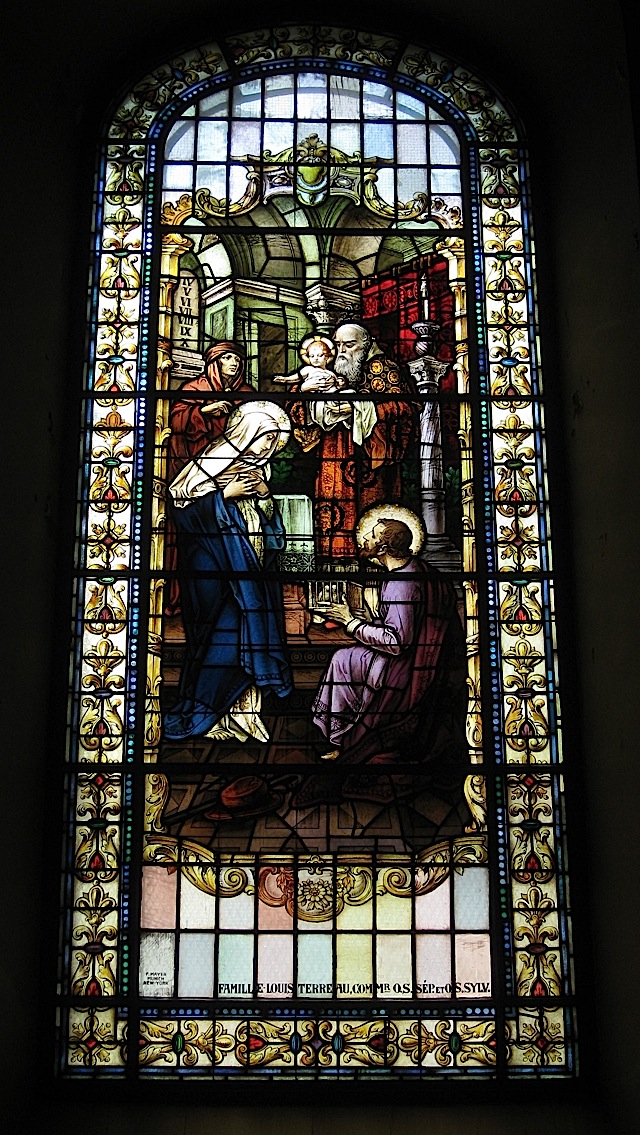 stained glass window at the Notre-Dame de Québec depicting the presentation of Jesus at the temple