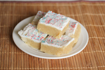 photo of Sugar cookie bars stacked on a plate