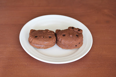 photo of two chocolate mochi on a plate