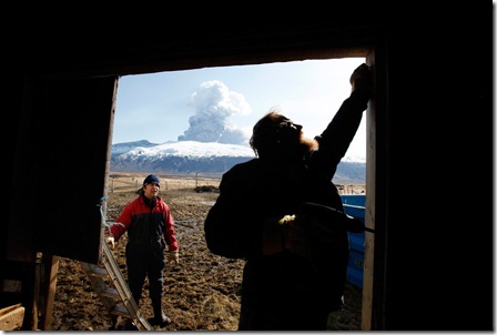 Sheep farmer Thorkell Eiriksson (R) and his brother-in-law Petur Runottsson work to seal a sheep barn, in case winds shift and ash from a volcano erupting across the valley lands on their farm, in Eyjafjallajokull April 17, 2010. The current season is when the spring lambs are born and such young animals are especially susceptible to volcanic ash in their lungs so they must be stored inside. (REUTERS/Lucas Jackson) #