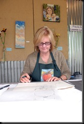 Paula Amerine at work on a drawing.