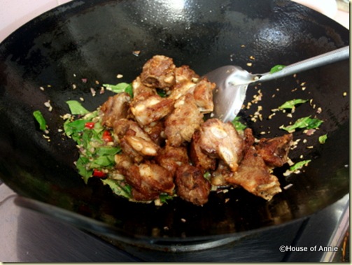 add fried pork to curry leaves shallots and chillies