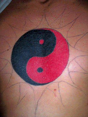 Shaolin symbol chest tattoo