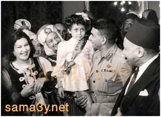 President Naguib holding the future star