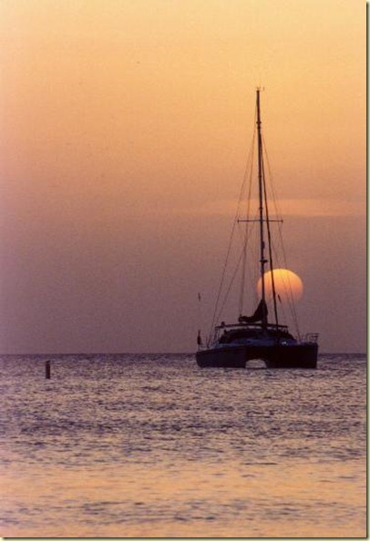 sunset of catamaran and moon from 7 mile beach