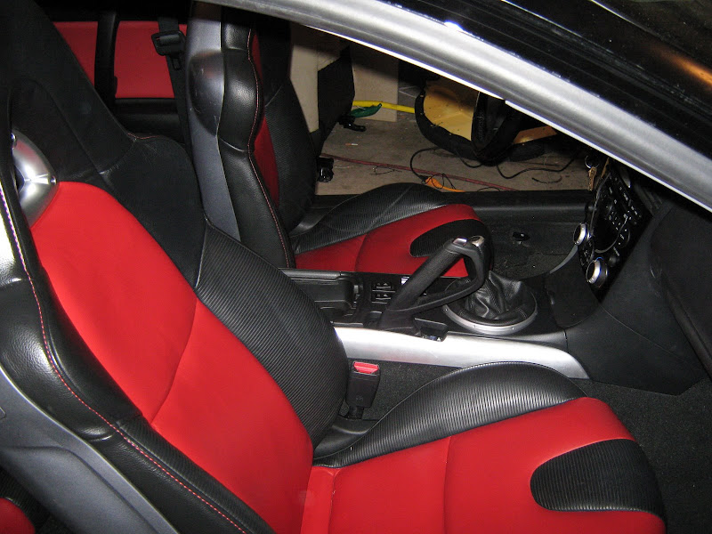 Interior Of The Suv Car With A Rebuilt Leather In Redblack Color In  Exchange For The Old Wornout Interior Trim In The Workshop For Repairing  The Seat Doors And Steering Wheels Stock