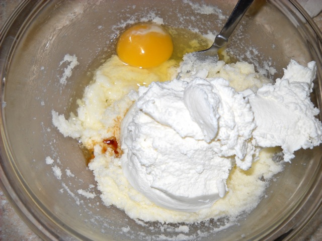 Eggs, Ricotta, Vanilla, butter and sugar in bowl 
