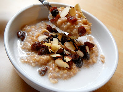 A spoonful of spiced coconut steel-cut oats being lifted from the bowl