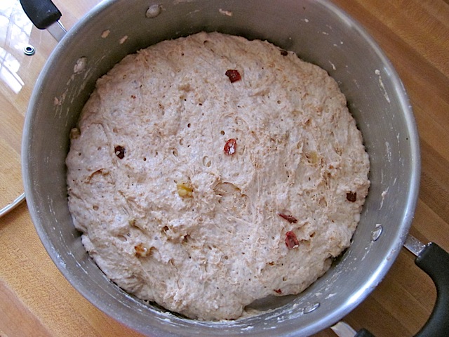 fluffy dough in pot after risen 