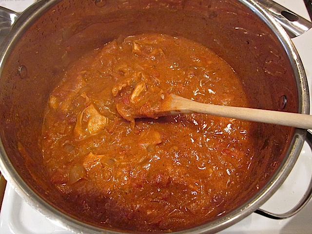 Finished chicken in stew mixture in pot 