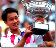 Michael Chang holding the French Open trophy