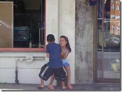 Siblings fighting waiting for their mum in the shop (they were really going for it)