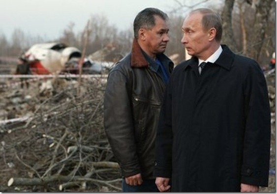 Russian Prime Minister Vladimir Putin, right, and Emergency Situations Minister Sergei Shoigu, left, visit the crash site of the Polish presidential plane, in which Polish President Lech Kaczynski died, near Smolensk, western Russia, Saturday, April 10, 2010. Kaczynski and some of the country's highest military and civilian leaders died on Saturday when the presidential plane crashed as it came in for a landing in thick fog in western Russia, officials said. (AP Photo/Alexei Nikolsky, Pool)