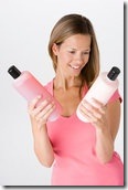 shampoo and conditioner in woman's hands