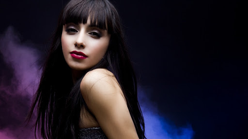 A Girl in Red Dress on the Bed