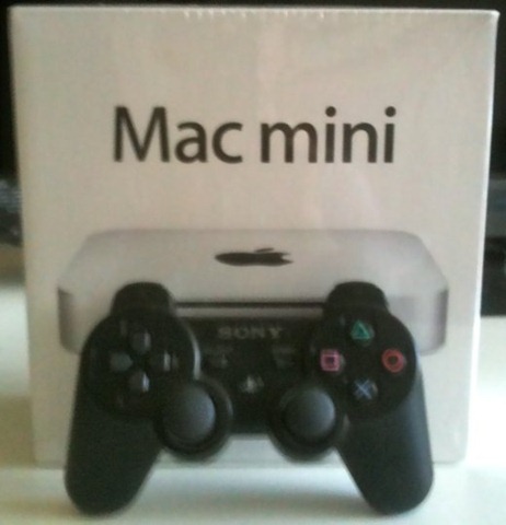 Mac mini's size compared with a Playstation 3 joystick