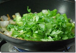 Add capsicum and coriander leaves Add capsicum and coriander leaves