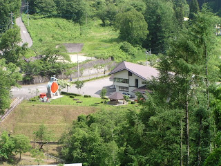 View of the powerhouse and waterwheels from the hill