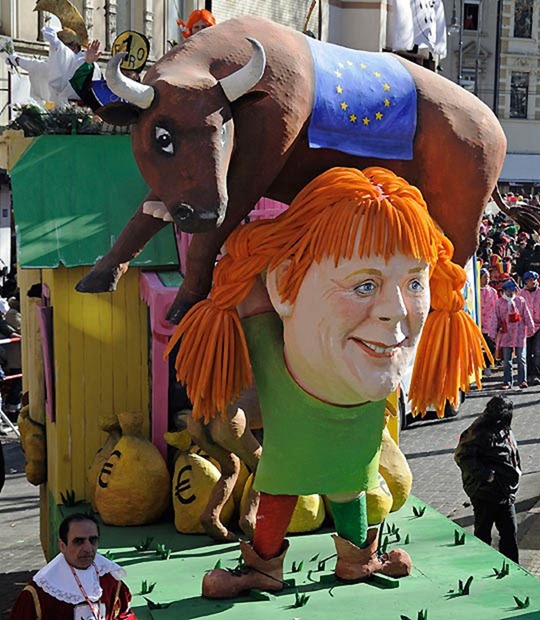 A carnival float shows German chancellor Angela Merkel as Pippi Longstocking with the European bull on her shoulders during the traditional Rosemonday carnival parade in Cologne, Germany, Monday, March 7, 2011.  The Rosemonday parade in Cologne, visited by one million spectators, is one of the highlights of the street carnival season. (AP Photo/Martin Meissner)