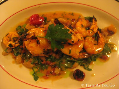 Shrimp Scampi served with Pancetta, Cannellini Beans, and Grape Tomatoes at Bond 45 in New York, NY - Photo by Taste As You Go