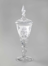 Wine glass with two hands around a heart