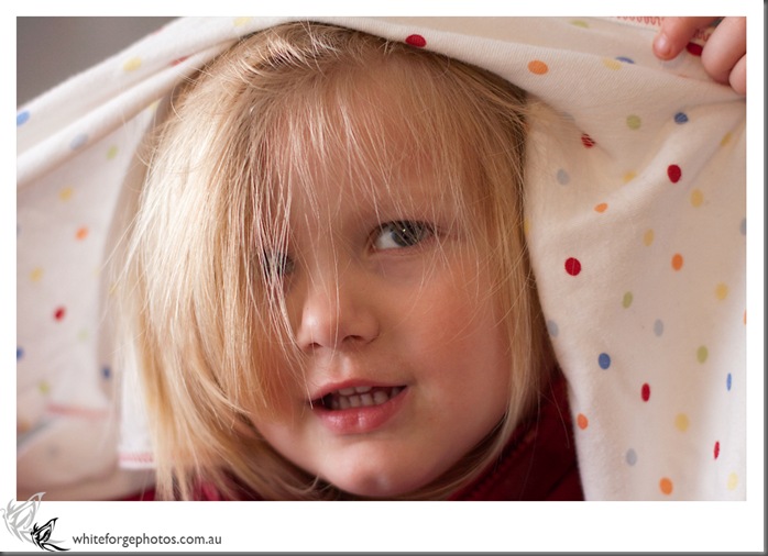 toddler under blanket