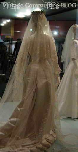 The dress is cream satin a very expensive bridal gown