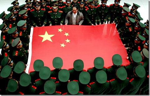 China Flag Held by Soldiers