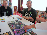 Players and a 'hand' during a game of Shadow Hunters