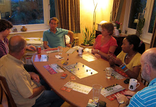 The players taking a moment out to consider the chaos on the game board