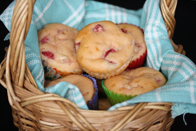 a basketful of strawberry cupcakes