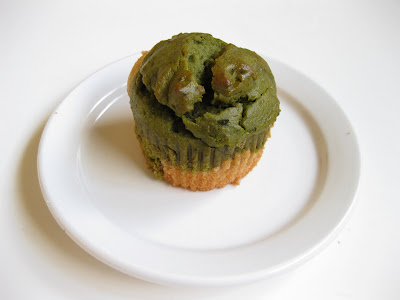 one Matcha Green Tea and White Cupcake on a white plate.